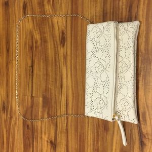 Cream colored floral design bag with magnetic and zipper closures